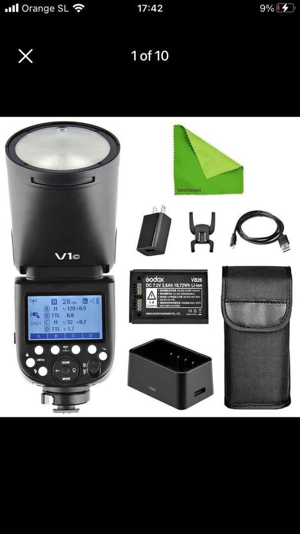 Godox V1c camera flash kit with accessories including a battery charger USB cable mount